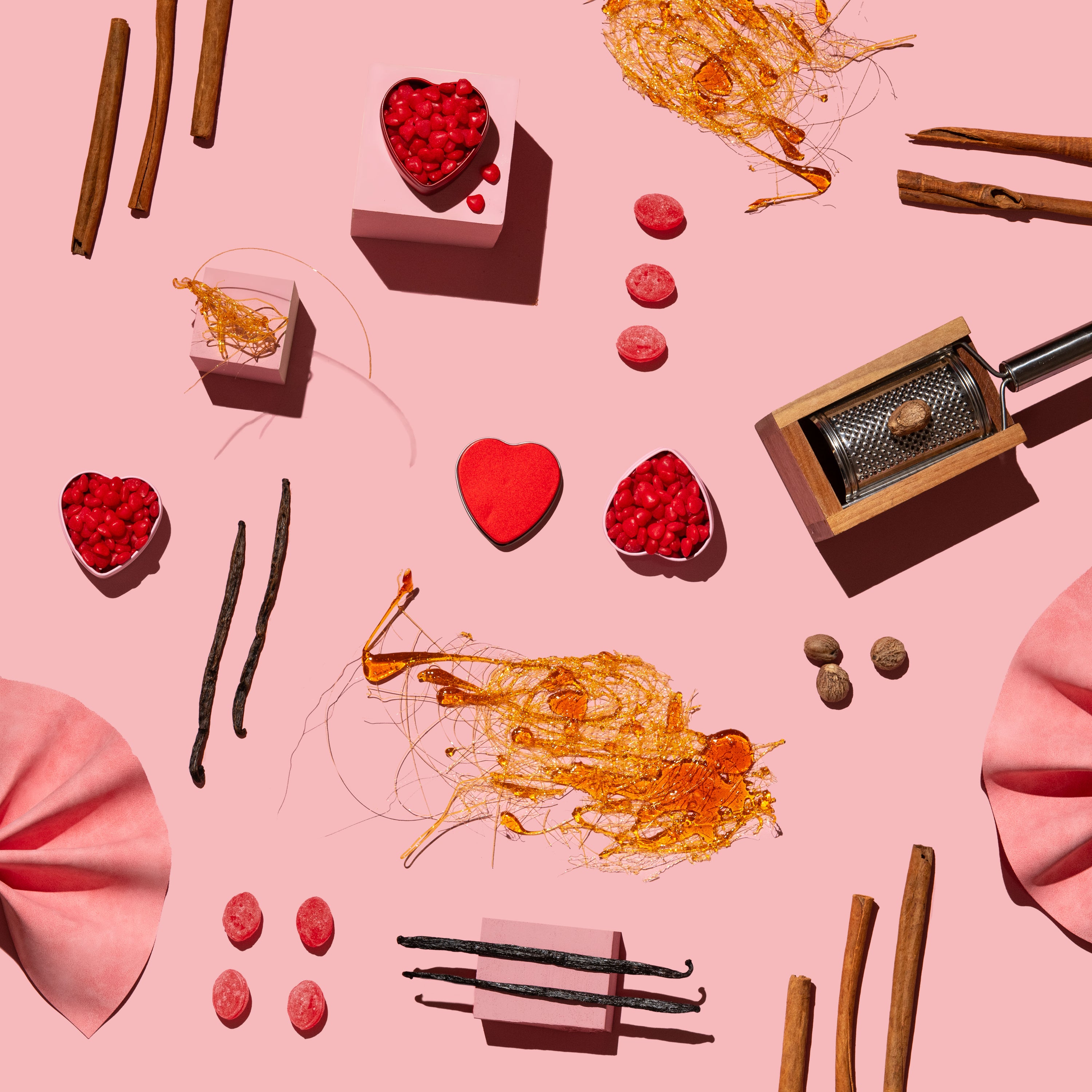 Spices and ingredients on a pink background