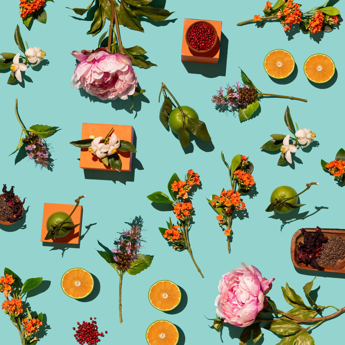 Pattern of flowers, fruits, and small boxes on a teal background