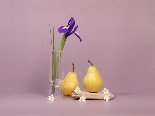 purple iris, white flowers, and pears on a purple background